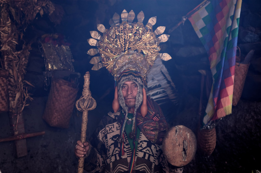 San Pedro shaman from Chavin de Huantar, Peru. He has a walking stick in his hand and a golden crown on his head