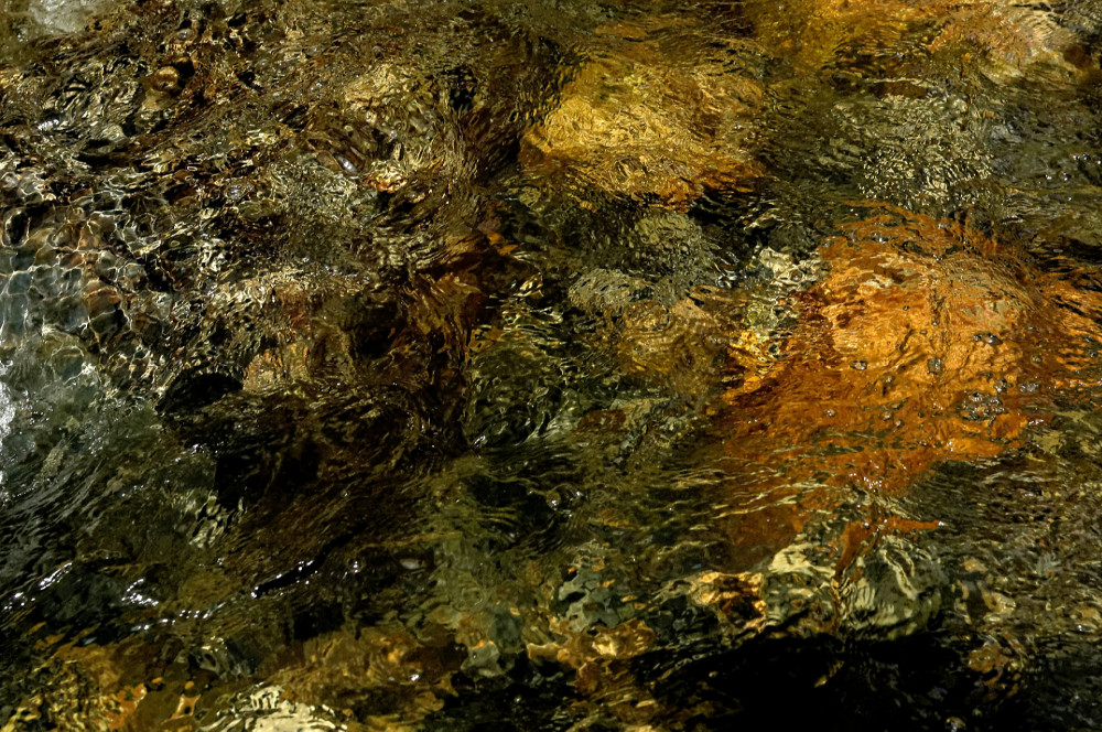 Photo taken during a session from San Pedro, Huachuma in Ecuador's Podocarpus National Park. Meeting with the San Pedro cactus. It is part of the "trance vision" cycle. An alternative psychedelic therapy session. Photo of water in a mountain river with a very fast exposure time of 1/4000. One of my favorite photos.