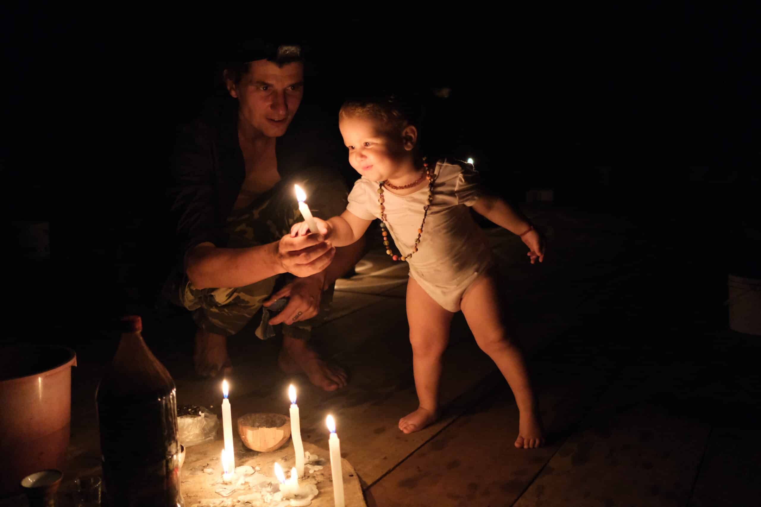 Child ayahuasca ceremony candle light